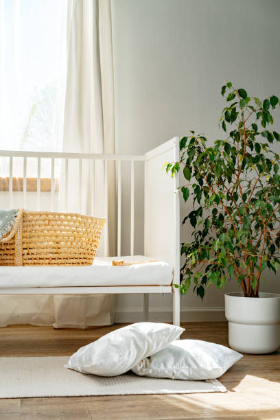 istock Nursery interior and bedding for kids with wicker bassinet 1815949300
