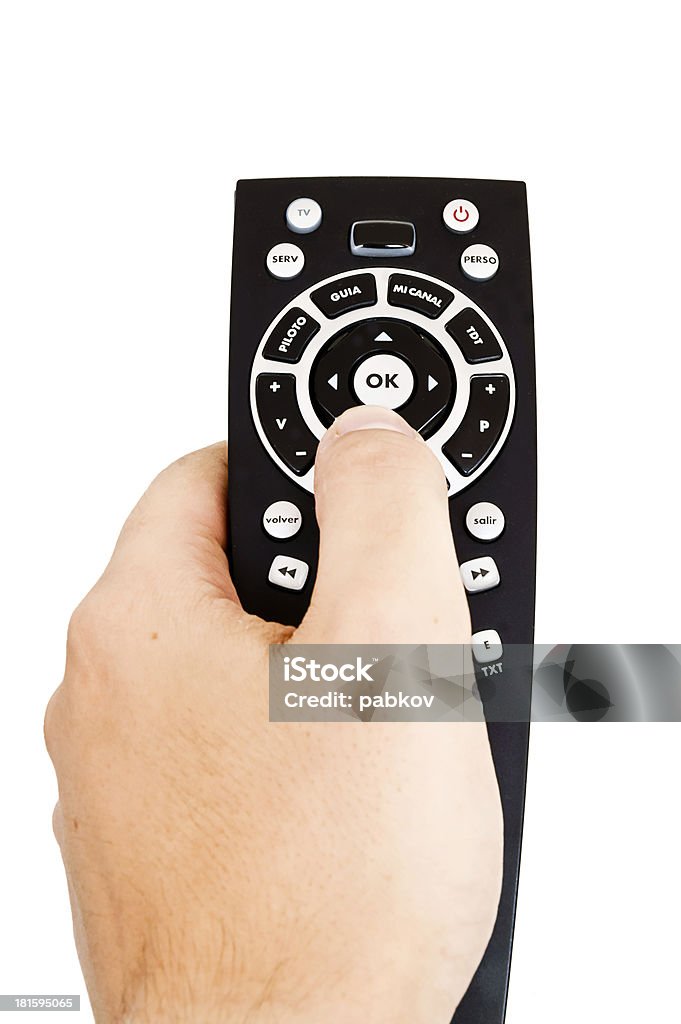 man holding a tv remote Aiming Stock Photo