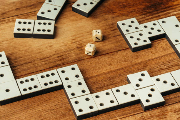 istock Domino game on brown wooden background close up 1815966068