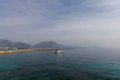 Pier in Alanya with motor boat