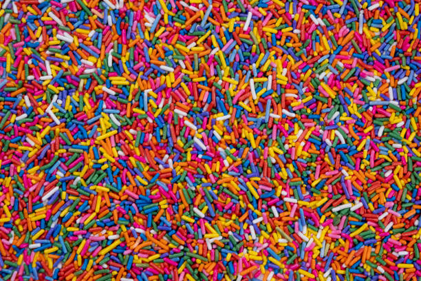 istock background of multi-colored sprinkles for sweets and multi-colored dragees or sweets. The concept of celebrating a birthday, party or other holidays. trendy, sweet background 1815995226