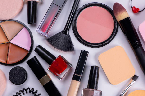 istock background with decorative cosmetics, blush, concealer, powder, shadows, nail polish, make-up brushes, brushes for eyelashes or eyebrows on a white background, the concept of cosmetic care products, beauty salon or beauty and fashion industry 1815996266