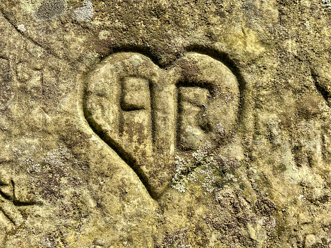 Heart engraved in an old wall.