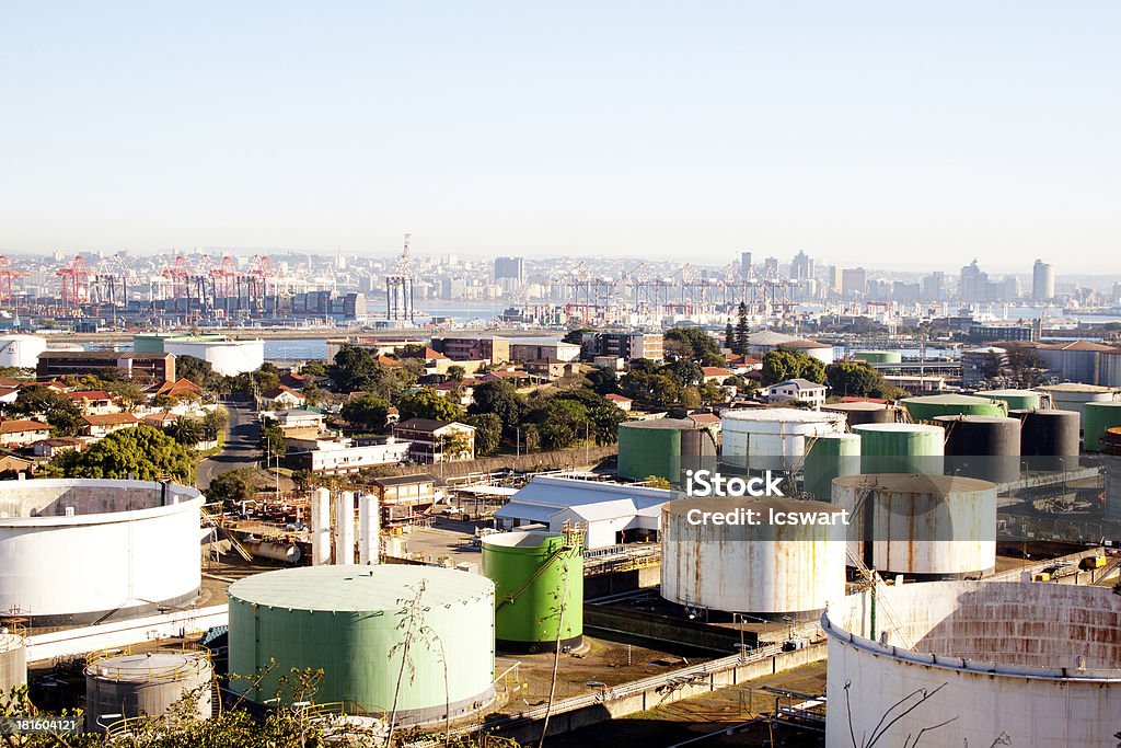 An Urban Residential and Industrial Landscape An urban industrial landscape with residences mass storage tanks harbour and city Architecture Stock Photo