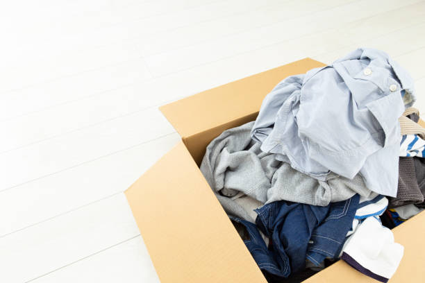istock Clothing packed in a cardboard box. 1816054918