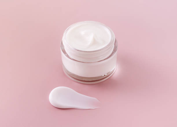 istock cream jar cosmetic smear cream texture on pastel pink background 1816055867