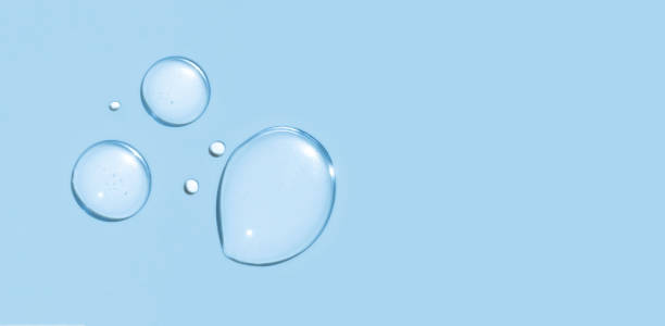 istock drops texture gel serum on blue background closeup 1816056095