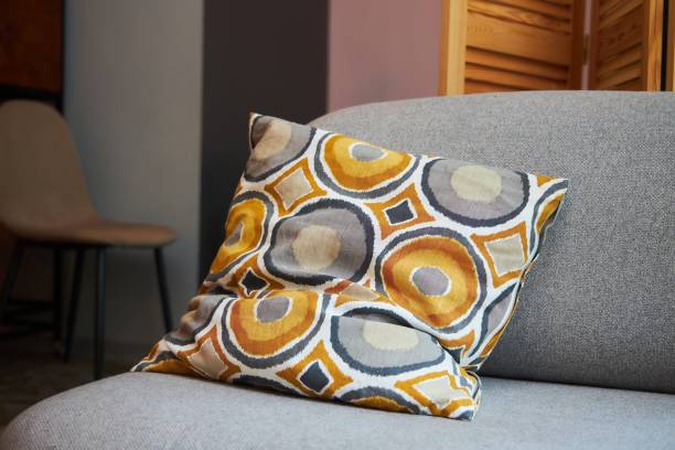 istock An African or oriental pattern pillow lies on the sofa. Interior design 1816060456