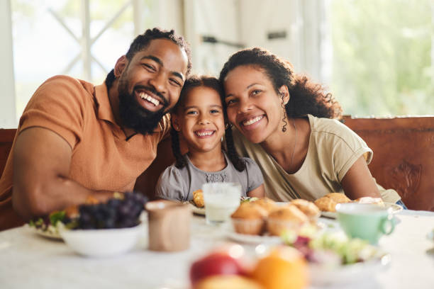 istock Happy black family enjoying during breakfast at dining table. 1816072522