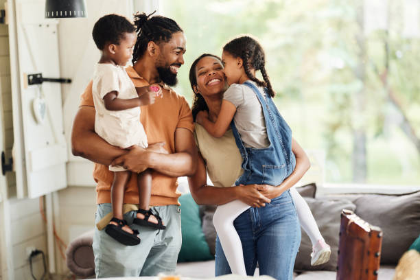 istock Happy black family talking while enjoying at home. 1816075216