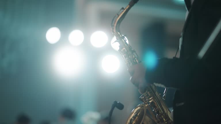 Close-up of the musician playing the saxophone