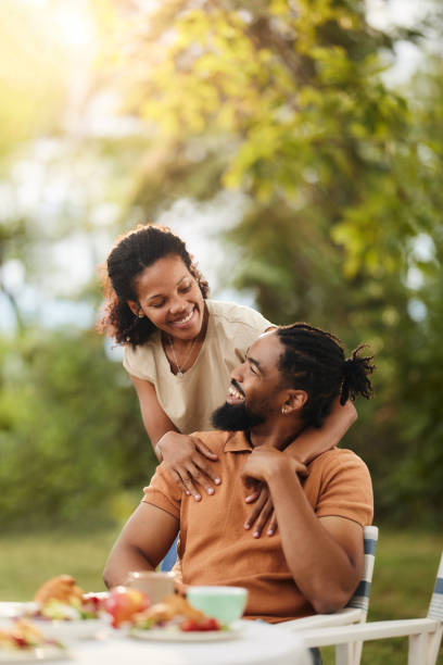 istock Loving black couple talking during a meal in the backyard. 1816078406
