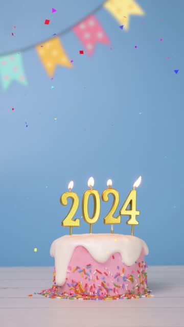 looping of cake with candle 2024 for new year celebrate party with confetti