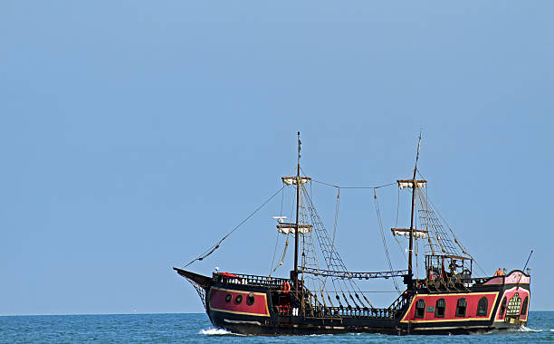 istock pirate ship sails the seas in search of Board 181609511