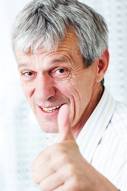 istock Very busy older man using a few phones 181609588