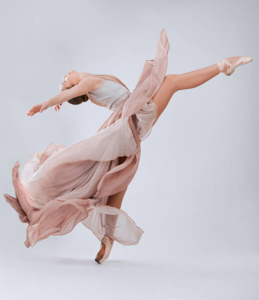 istock Ballet, dance and woman with creative freedom isolated on a white background in a studio. Art, training and ballerina dancer dancing with elegance, class and beauty in a room with a backdrop 1816097703