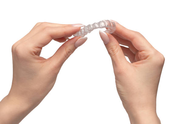istock Transparent mouth guard in a woman's hand isolated. 1816110196