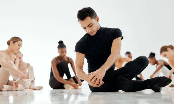 istock Ballet, creative and man dancer training for show, performance or concert at dance school. Art, elegant and classy young male ballerina stretch and practicing with skill for theater in studio. 1816129581