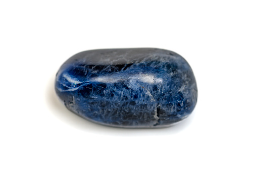 Beautiful isolated blue sodalite gemstone closeup isolated