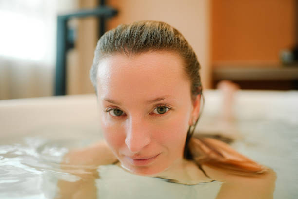 istock Sensual model enjoying spa routine at evening bathroom 1816152752
