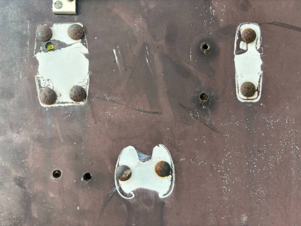 istock White painted old rusted door lock with handle removed 1816161902