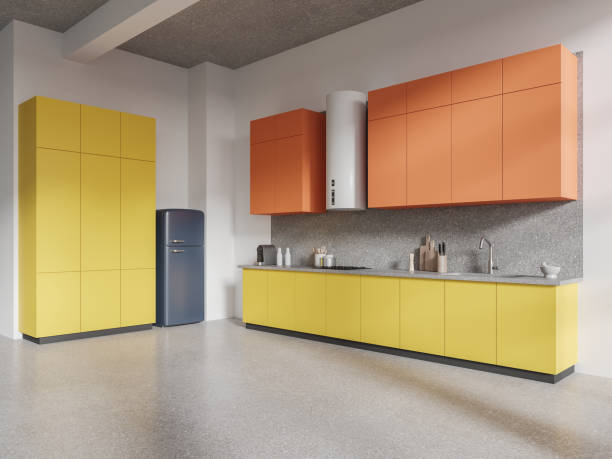 istock White, orange and yellow kitchen corner with cabinets and fridge 1816196602