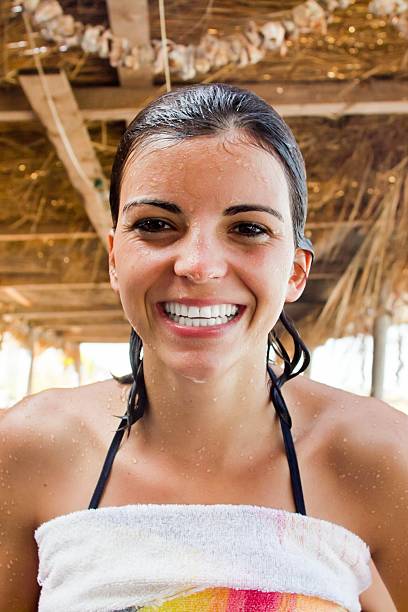 istock Wet girl smiling in towel 181620622
