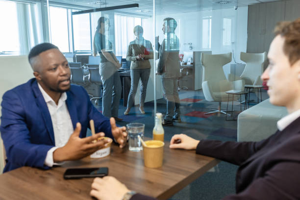 istock Businessmen, colleagues chatting on a lunch break 1816216194