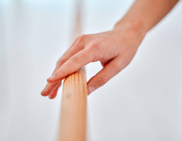 istock Ballet, training and hands on barre for exercise, practice or performance in studio. Ballerina, art and creative woman ready to start workout, exercising or dancing for theatre, routine or dance. 1816224355