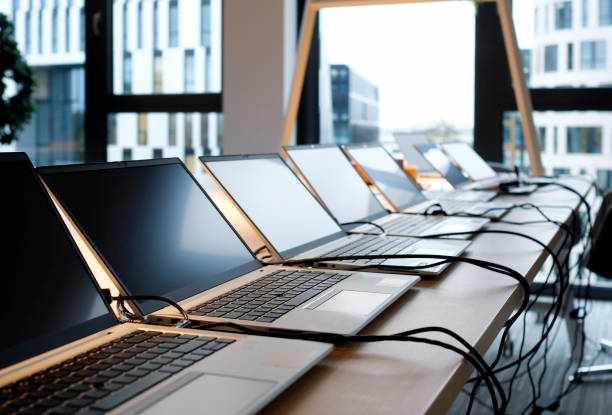 istock Row of laptops being prepared and set up 1816231224