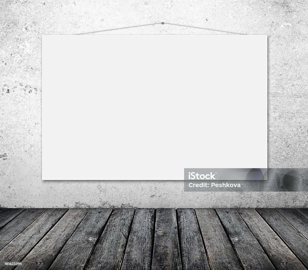 blank poster blank poster on wall in grunge room Backgrounds Stock Photo