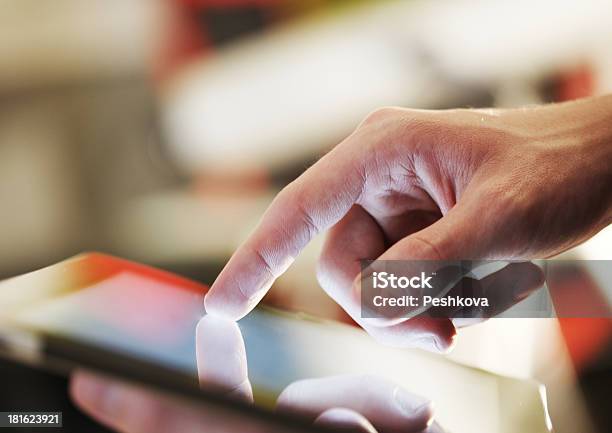 Close Up Of Mans Hand Poring On Tablet Device Stock Photo - Download Image Now - Close-up, Communication, Computer Monitor