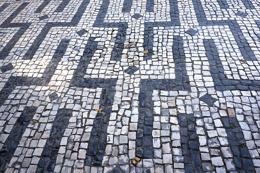 One of Geometric Patterns in Traditional Mosaic Paving Tiles in Braga, Portugal.