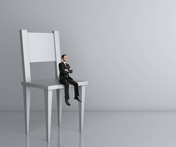 istock man sitting a big chair 181624083