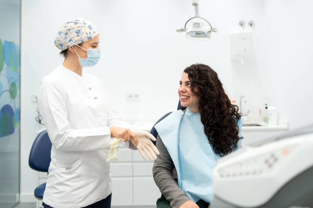 istock Dentist talking to a client before to start a procedure 1816248431