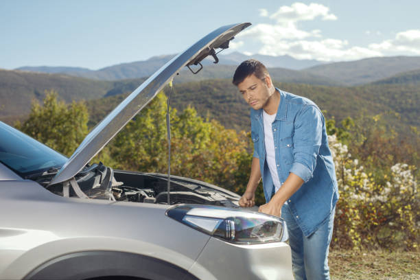 istock Young man checking an engine of a vehicle 1816262667