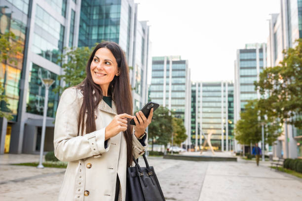 istock Businesswoman heading to the office, using mobile phone 1816263236