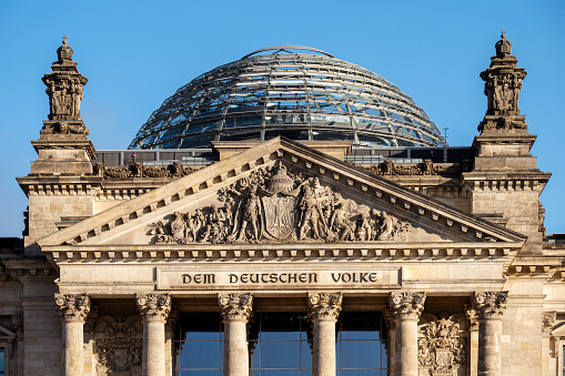 Detail of the historic entrance portal of the German Bundestag in the Reichstag building.