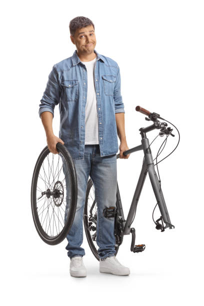 istock Man carrying a bicycle with a broken wheel 1816275586