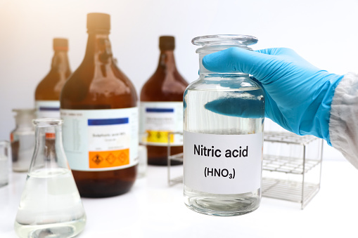 Nitric acid in containers, Hazardous chemicals and raw material, chemical in industry or laboratory