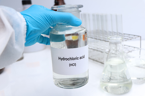 Hydrochloric acid in containers, Hazardous chemicals and raw material, chemical in industry or laboratory