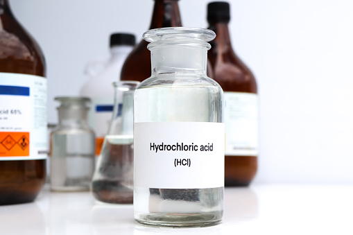 Hydrochloric acid in containers, Hazardous chemicals and raw material, chemical in industry or laboratory