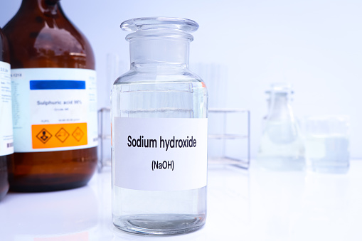 Sodium hydroxide in containers, Hazardous chemicals and raw material, chemical in industry or laboratory