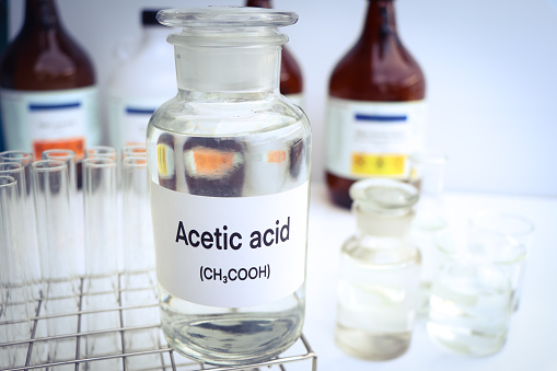 Acetic acid in containers, Hazardous chemicals and raw material, chemical in industry or laboratory