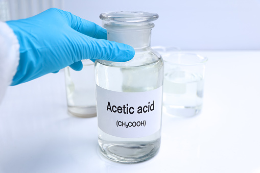 Acetic acid in containers, Hazardous chemicals and raw material, chemical in industry or laboratory