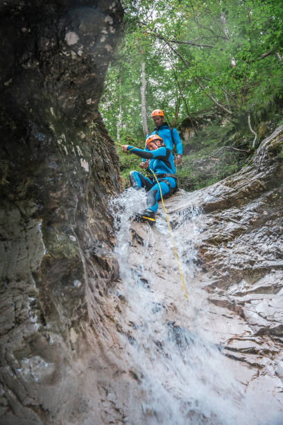 istock Caucasian Woman Sliding at Canyoning 1816296033