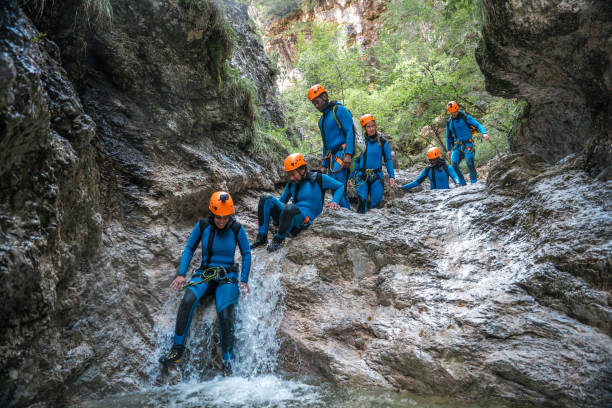 istock Slide Action in Canyoning with Diverse Participants 1816298199