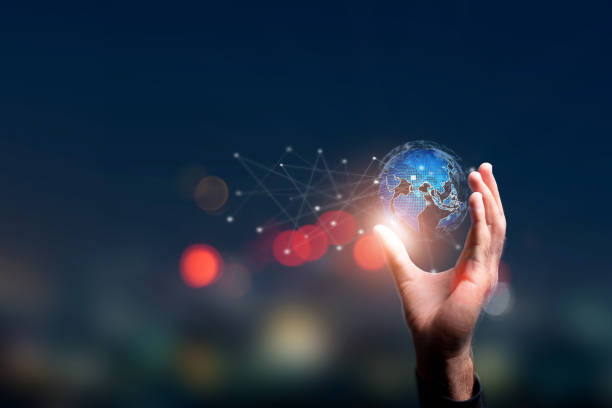 istock entrepreneur holding worldwide network linkage. Business intelligence and big data analytics are concepts. Global business point and line composition concept on a world map 1816305374