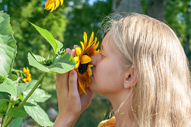 istock Girl with sun flowers 181631153