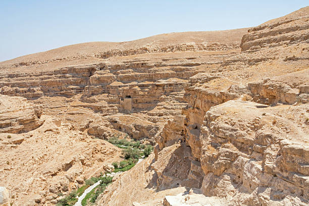 istock Kidron river canyon with cave monk cell in steep wall 181631602
